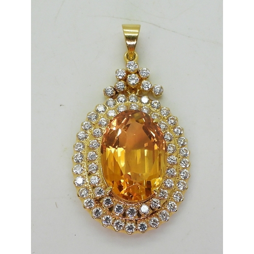 2739 - A CITRINE SUITEset throughout in bright yellow metal, the pendant is set with a large citrine of app... 