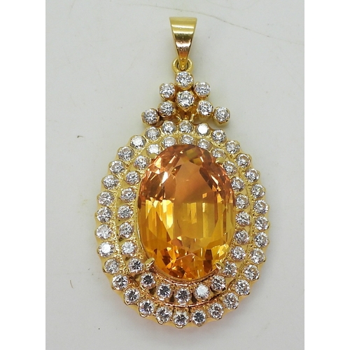 2739 - A CITRINE SUITEset throughout in bright yellow metal, the pendant is set with a large citrine of app... 