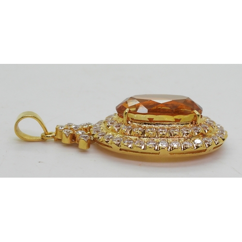 2739 - A CITRINE SUITEset throughout in bright yellow metal, the pendant is set with a large citrine of app... 