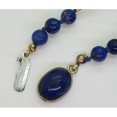 2743 - LAPIS LAZULI BEADSinterspaced with bright yellow metal tube beads, length 68cm, weight 40.4gms, clas... 