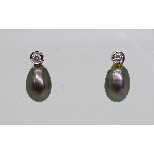 2744 - DIAMOND EARRINGSthe first pair in 18ct white gold set with drop shaped black pearls 9mm long, enhanc... 