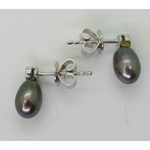 2744 - DIAMOND EARRINGSthe first pair in 18ct white gold set with drop shaped black pearls 9mm long, enhanc... 