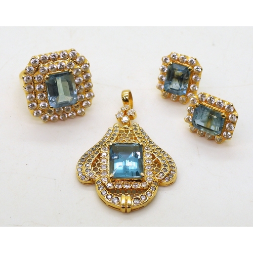 2746 - A BLUE TOPAZ SUITEcomprising of a pendant further set with cubic zirconia, stamped SA 18K to the bac... 