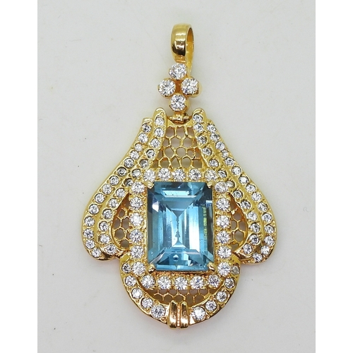 2746 - A BLUE TOPAZ SUITEcomprising of a pendant further set with cubic zirconia, stamped SA 18K to the bac... 