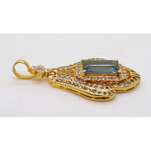 2746 - A BLUE TOPAZ SUITEcomprising of a pendant further set with cubic zirconia, stamped SA 18K to the bac... 