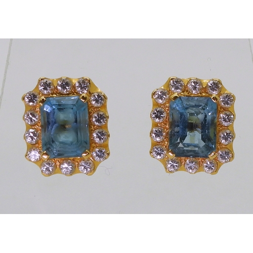 2746 - A BLUE TOPAZ SUITEcomprising of a pendant further set with cubic zirconia, stamped SA 18K to the bac... 