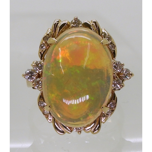 2747 - AN OPAL STATEMENT RINGset with a 18.5mm x 13mm x 5.6mm cabochon jelly opal, the 14k gold mount is fu... 