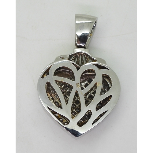 2752 - DIAMOND HEART PENDANTthe mount is craftsman made in white metal (stamped MC) and set throughout with... 