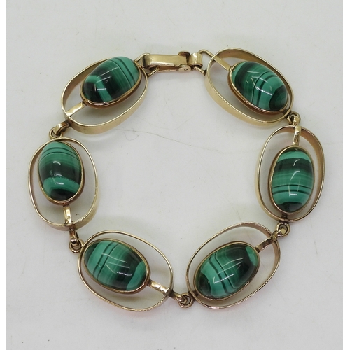 2754 - A RETRO BRACELETmade in South Africa, the oval links are set with malachite, stamped 9ct to both the... 