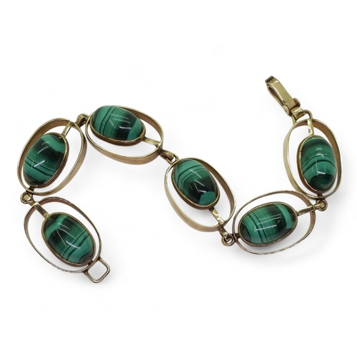 2754 - A RETRO BRACELETmade in South Africa, the oval links are set with malachite, stamped 9ct to both the... 