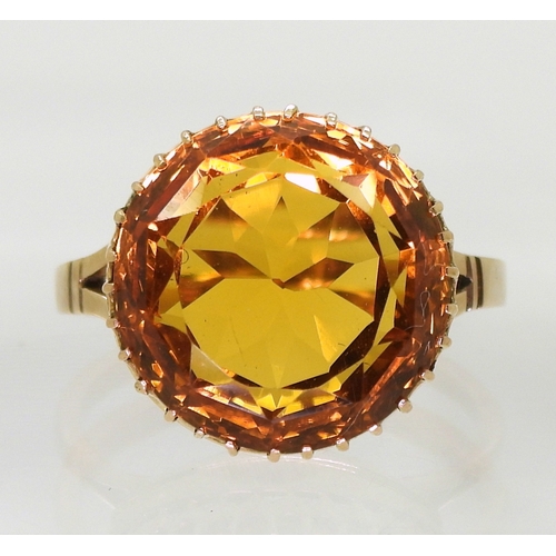 2756 - A CITRINE RINGa statement piece with a 14mm orange citrine in a multi clawed galleried mount, finger... 