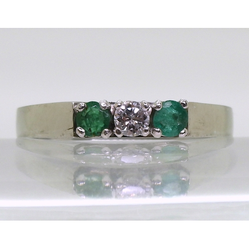 2758 - EMERALD & DIAMOND RINGthe retro ring is made in 18ct white gold and set with two 3.2mm emeralds ... 