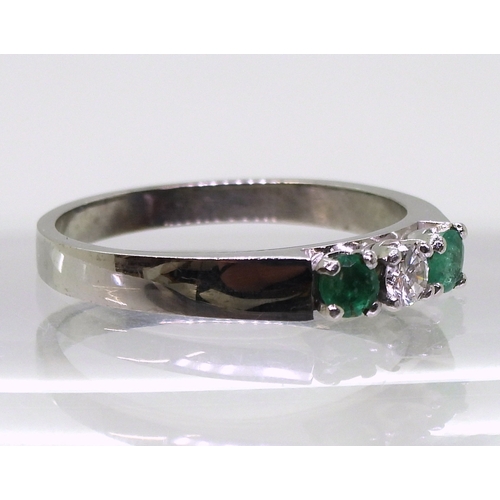 2758 - EMERALD & DIAMOND RINGthe retro ring is made in 18ct white gold and set with two 3.2mm emeralds ... 