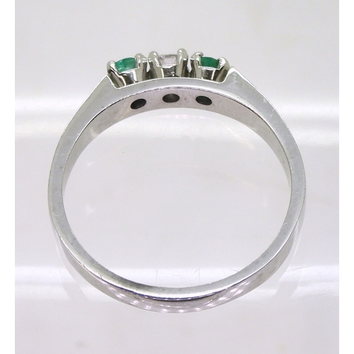 2758 - EMERALD & DIAMOND RINGthe retro ring is made in 18ct white gold and set with two 3.2mm emeralds ... 