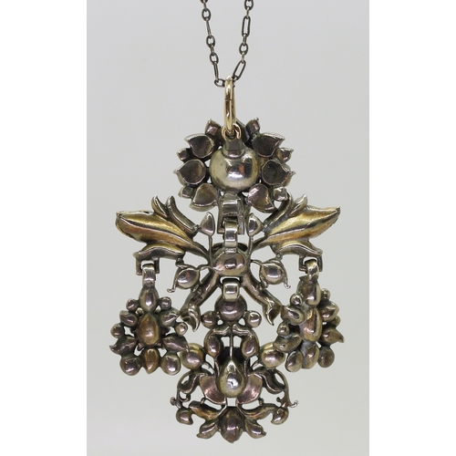 2767 - AN AUSTRO-HUNGARIAN JEWELthe yellow and white metal pendant, set with emeralds in yellow metal cut b... 