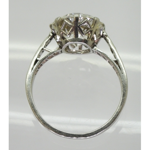 2771 - A SUBSTANTIAL DIAMOND RINGthe diamond is estimated approx at 4cts, mounted in platinum, with a prett... 