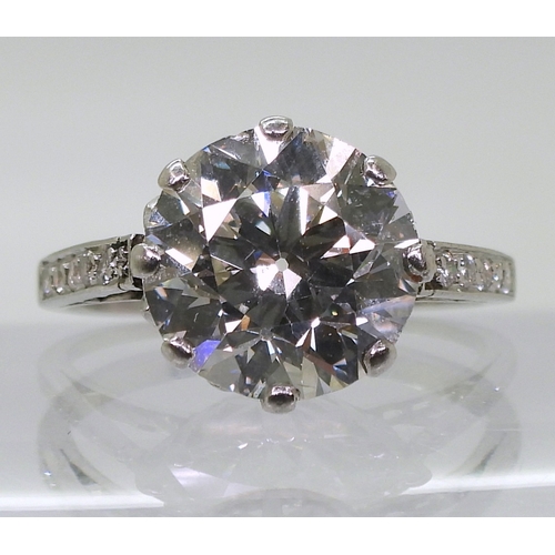 2771 - A SUBSTANTIAL DIAMOND RINGthe diamond is estimated approx at 4cts, mounted in platinum, with a prett... 