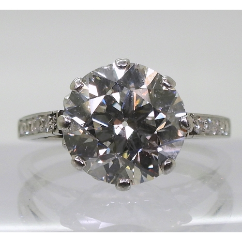 2771 - A SUBSTANTIAL DIAMOND RINGthe diamond is estimated approx at 4cts, mounted in platinum, with a prett... 