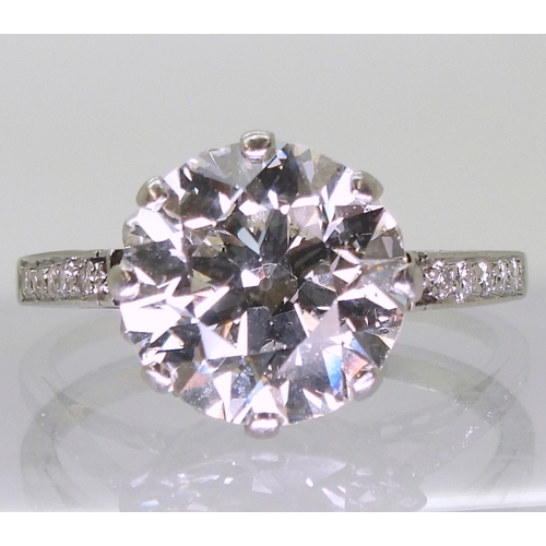 2771 - A SUBSTANTIAL DIAMOND RINGthe diamond is estimated approx at 4cts, mounted in platinum, with a prett... 