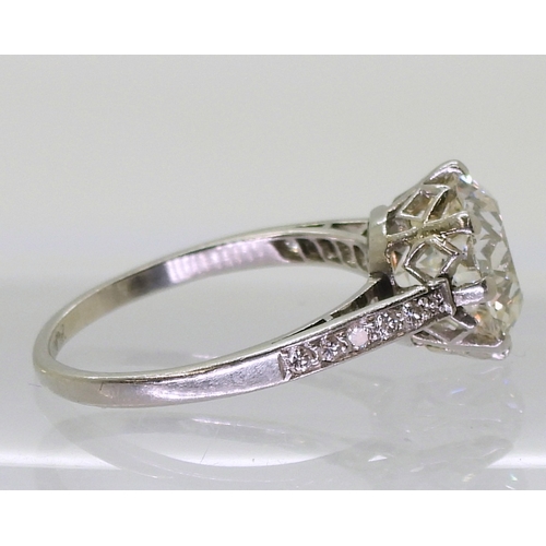 2771 - A SUBSTANTIAL DIAMOND RINGthe diamond is estimated approx at 4cts, mounted in platinum, with a prett... 