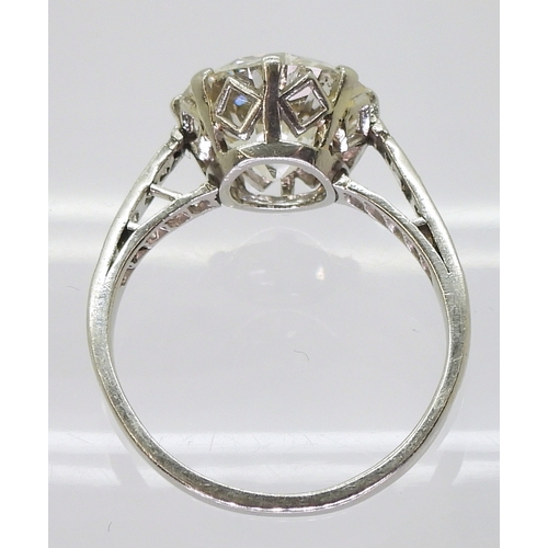 2771 - A SUBSTANTIAL DIAMOND RINGthe diamond is estimated approx at 4cts, mounted in platinum, with a prett... 