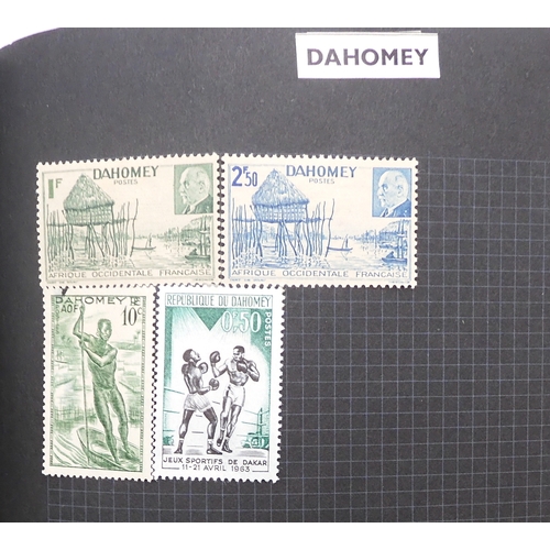 7012 - A worldwide stamp collection in a stock book and albums