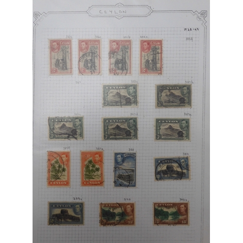 7041 - A world wide stamp collection with seven folders containing sheets of hinged used stamps many early ... 