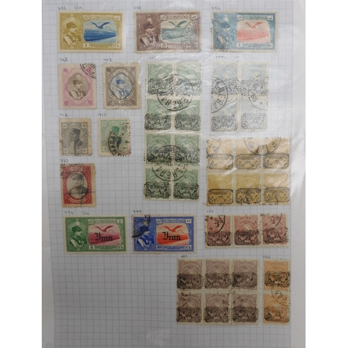 7041 - A world wide stamp collection with seven folders containing sheets of hinged used stamps many early ... 