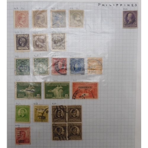 7041 - A world wide stamp collection with seven folders containing sheets of hinged used stamps many early ... 