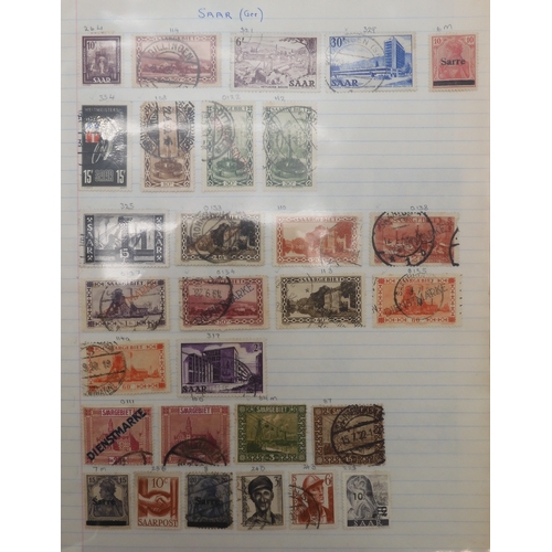 7041 - A world wide stamp collection with seven folders containing sheets of hinged used stamps many early ... 