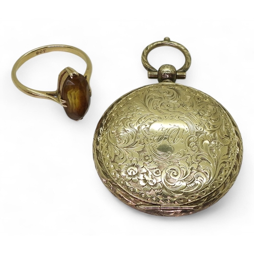 730 - A yellow metal locket engraved with flowers and monogramed the interior dedicated to the 'memory of'... 