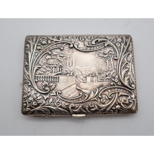 355 - A silver cigarette case, by Henry Matthews, Birmingham 1901, with cast decoration of a courting scen... 