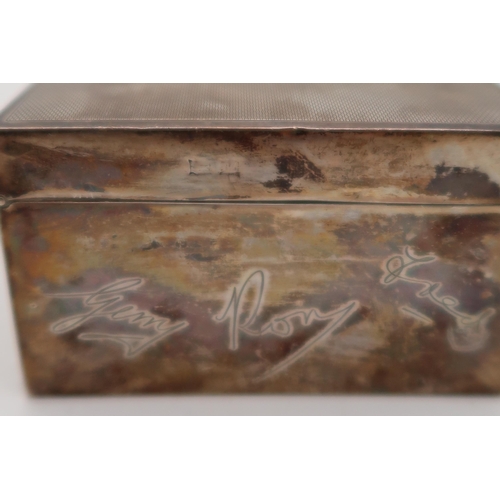 376 - A silver cigarette box, marks rubbed, engraved with facsimile signatures, 17 x 8.5 x 5cm