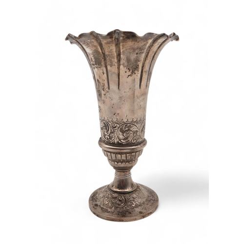 377 - A late-Victorian silver vase, London 1897, of flaring form, engraved with scrolling foliate decorati... 