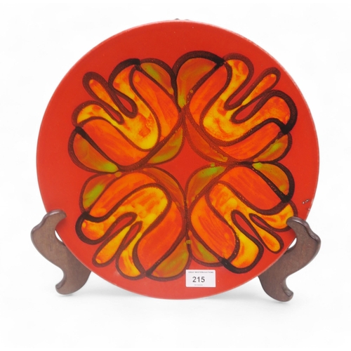 215 - A Poole pottery Delphis charger in red, orange and yellow