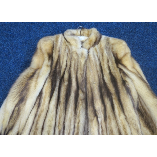 227 - A long striped fur coat