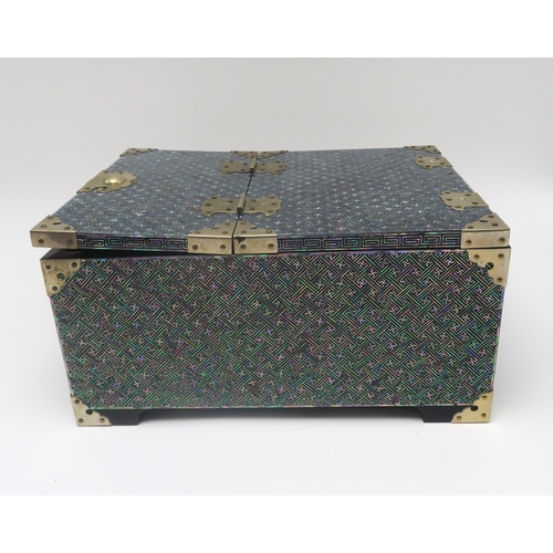 269 - A contemporary mother of pearl and black lacquer jewellery box, with fold up top, containing a mirro... 