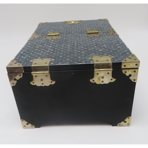 269 - A contemporary mother of pearl and black lacquer jewellery box, with fold up top, containing a mirro... 