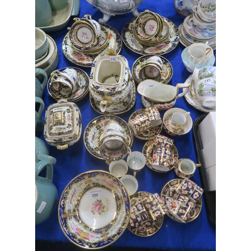 286 - An early Coalport tea service decorated with birds and flowers in a gilt and blue border, pattern nu... 