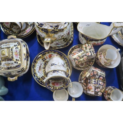 286 - An early Coalport tea service decorated with birds and flowers in a gilt and blue border, pattern nu... 