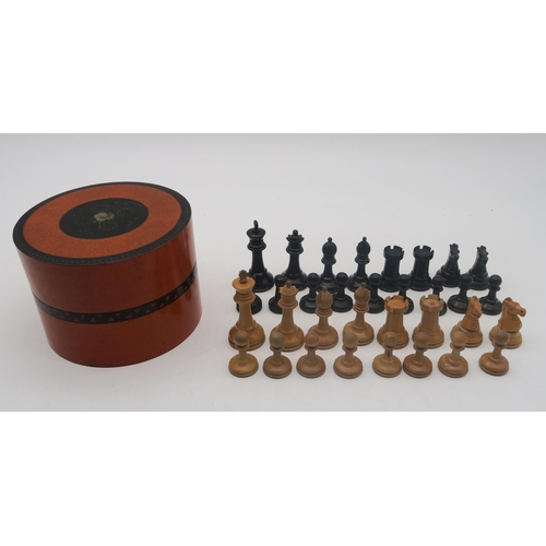 511 - A boxwood and ebony chess set (non-weighted), with kingside knights and rooks stamped with crown dev... 