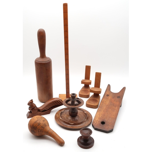 517 - A collection of treen, to include a substantial masher, two gilder's agate burnishers, a pair of Ind... 