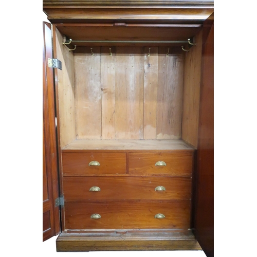 13 - A late 19th century mahogany and burr walnut veneered triple door wardrobe with cornice over central... 