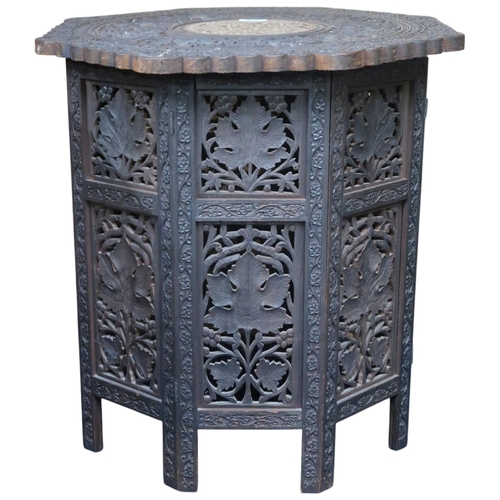 18 - An early 20th century Anglo-Indian hardwood octagonal topped occasional table, carved foliate and ac... 