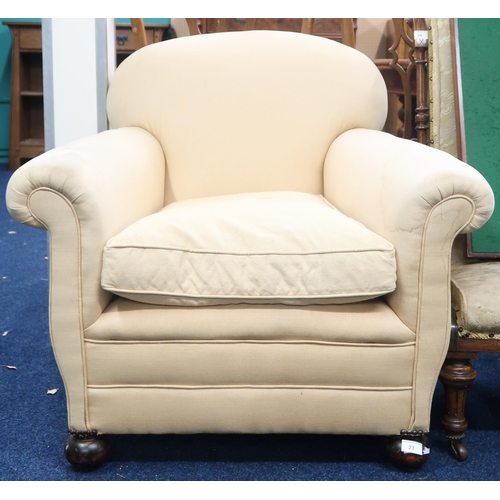 23 - A 20th century upholstered scroll armed club armchair, 81cm high x 86cm wide x 83cm deep