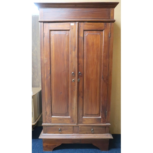 31 - A contemporary hardwood two door chifforobe with cornice over panelled doors over two short drawers ... 