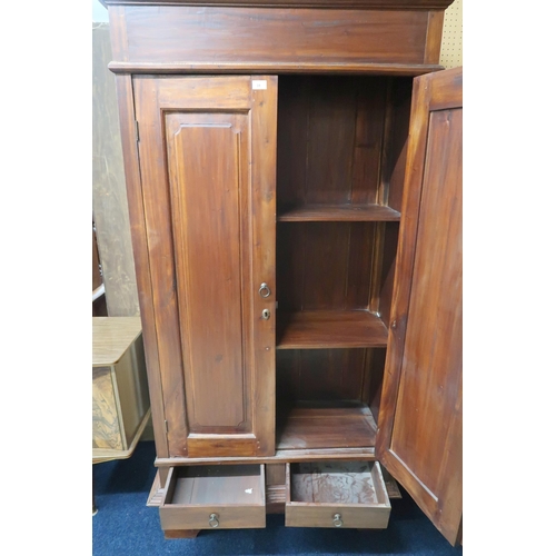 31 - A contemporary hardwood two door chifforobe with cornice over panelled doors over two short drawers ... 