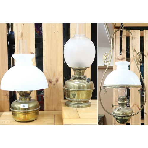 34 - A lot comprising a Victorian brass hanging oil lantern with opaque glass shade and another two brass... 