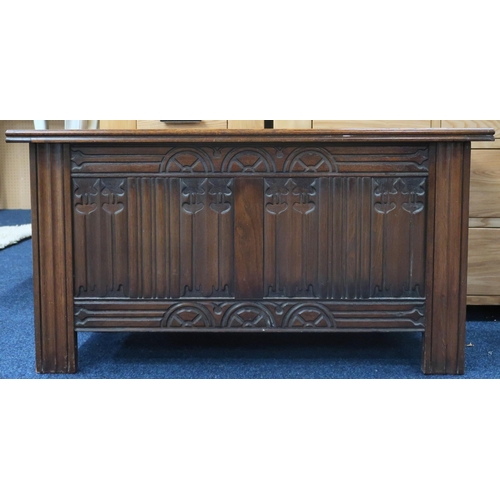 44 - A 20th century oak linen fold front blanket chest, 52cm high x 99cm wide x 40cm deep