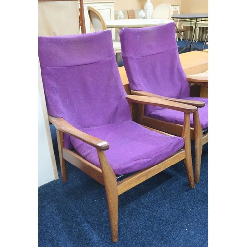 46 - A pair of mid 20th century teak Furpro (Furniture Productions Ltd) lounge chairs with purple upholst... 